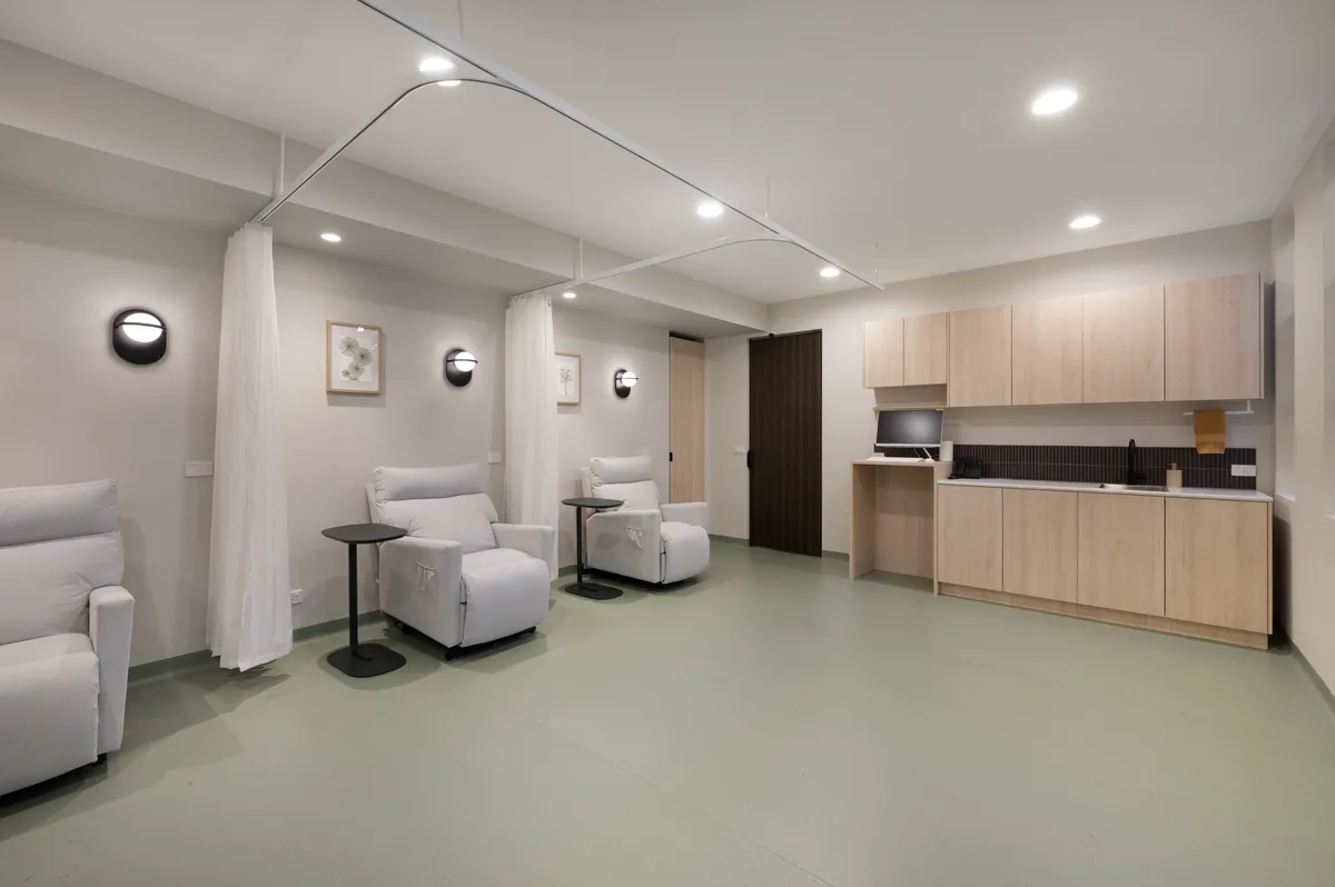 Infusion treatment room with comfortable recliners and nursing station at Hunter Blood Group